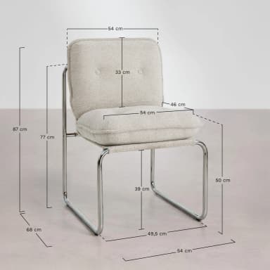 A modern cantilever chair featuring a continuous tubular chrome frame and light beige, textured bouclé-like fabric upholstery. The chair includes separate, plush seat and back cushions, with the backrest adorned with subtle button tufting. Its armless design and standard seat height make it suitable for dining or as an accent piece. Dimensions are provided, with an overall height of 87 cm and a seat height of approximately 50 cm. — 3D model