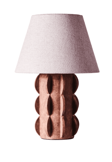 A contemporary table lamp featuring a sculptural, reddish-brown base with a repeating convex-concave 'bobble' pattern, topped by a light-colored, slightly textured conical fabric shade. — 3D model