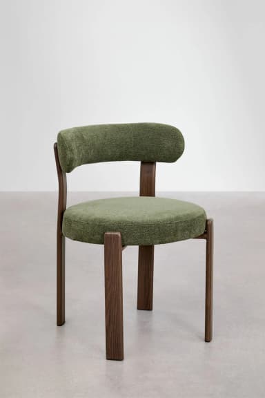 A contemporary chair featuring a dark wood frame and green upholstered seat and back. The backrest is curved and supported by two prominent wooden uprights from the rear legs. — 3D model