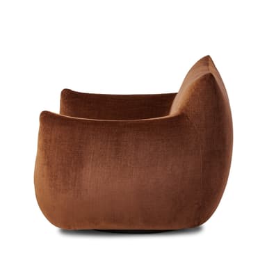 A contemporary lounge chair featuring a distinctive barrel-shaped silhouette, upholstered in a rich, reddish-brown velvet fabric. The chair is characterized by its deep, plush seating and integrated, low-profile armrests and backrest, which form a continuous, enveloping curve, suggesting substantial comfort and a modern aesthetic. It lacks visible legs, appearing to rest directly on a recessed base. — 3D model