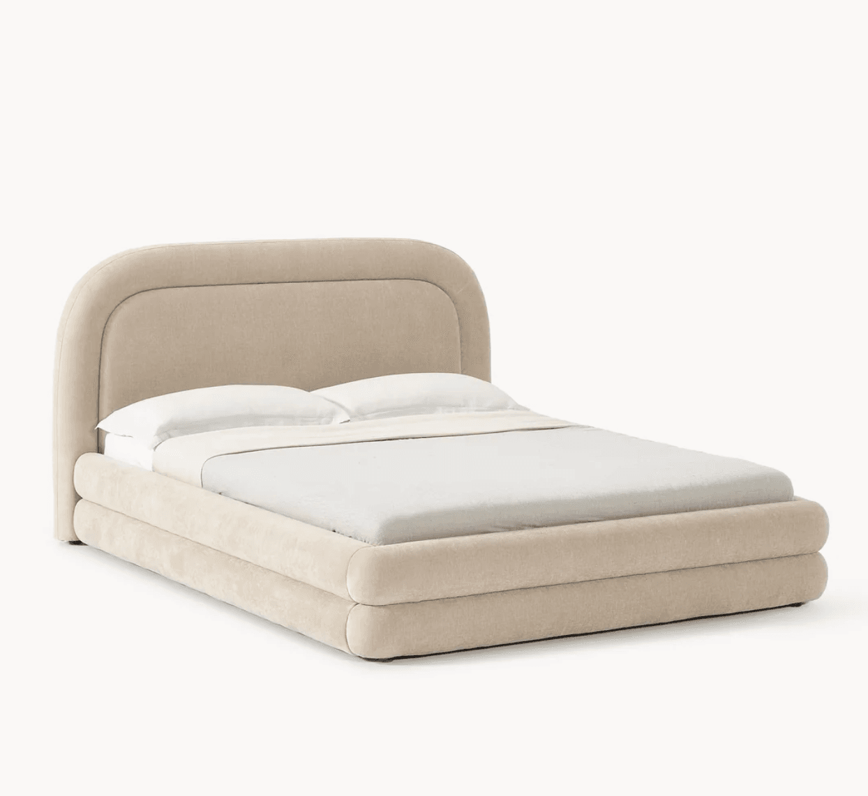 A upholstered bed frame with a rounded headboard and footboard. The frame is composed of plush, rounded elements, giving it a soft and inviting appearance. The bed is dressed with white bedding, including pillows and a duvet. — 3D model