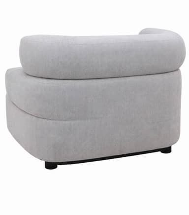 A contemporary armchair with a rounded, enveloping design. The chair features a thick, upholstered seat and backrest with a curved, continuous form. The base is low-profile, supported by small, dark legs. — 3D model