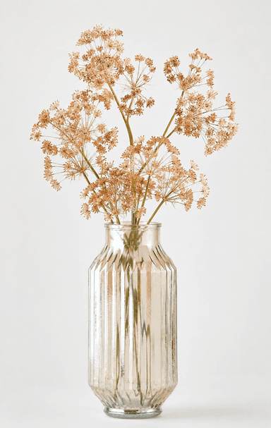 A decorative silvered glass vase with a fluted texture, holding an arrangement of dried, light brown umbelliferous flowers. The vase has a classic bottle shape with a narrow neck, wider body, and a reflective metallic finish. — 3D model