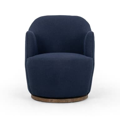 A contemporary armchair upholstered in a textured navy blue fabric. It features a rounded back and integrated armrests that curve gently downwards. The chair is supported by a circular, dark wood swivel base, allowing for 360-degree rotation. The upholstery has a boucle or similar textured finish. — 3D model