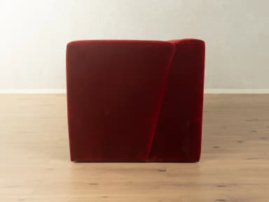 A two-seater sofa with a distinct geometric design. It features deep red velvet upholstery, high, angular armrests that extend downwards to form the base, and a single seat cushion. — 3D model