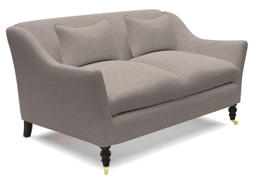 A two-seater sofa upholstered in a textured, light gray fabric. It features a gently curved backrest that extends into short, flared arms. Two matching lumbar pillows are placed on the seat. The sofa is supported by four short, turned wooden legs in a dark finish, with brass casters on the front legs. — 3D model