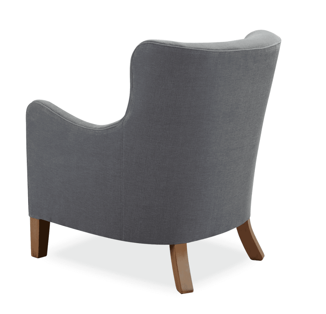 A gray upholstered armchair viewed from the rear. The armchair features a high back with a gently curved top edge, flared arms, and wooden legs. The upholstery appears to be a textured fabric, and the legs are angled and tapered. — 3D model