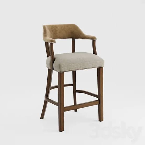 A bar stool featuring a sturdy dark brown wooden frame, an upholstered seat, and a gracefully curved upholstered backrest that extends into integrated armrests. Both the seat and the back/armrests are accented with decorative brass-toned nailhead trim along their edges. The design includes horizontal stretchers between the legs, serving as a functional footrest. — 3D model