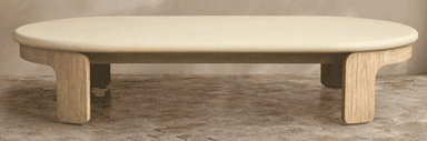 A cream-colored, oval-shaped decorative panel with a smooth, matte finish and softly rounded edges, presented against a subtly textured beige background. The object has a uniform thickness and a minimalist aesthetic. — 3D model