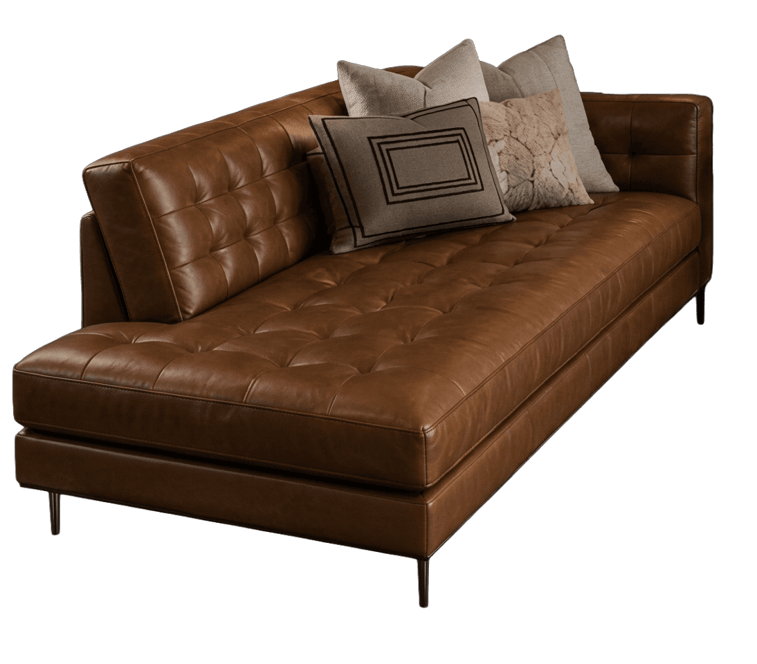 A modern tufted leather chaise lounge featuring a rich cognac brown finish, a single armrest, and slender black metal legs, accompanied by several decorative throw pillows. — 3D model