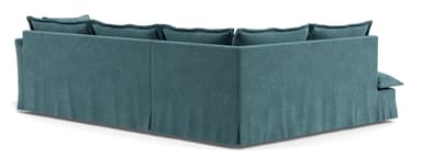 An L-shaped sectional sofa upholstered in a teal fabric, featuring deep seats and a casual, contemporary design. The sofa includes multiple loose back cushions and a wide chaise extension on the left side (when viewed from the front). It has a skirted base, suggesting a relaxed aesthetic. — 3D model