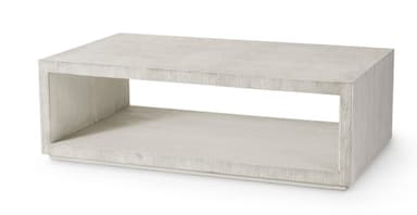 A rectangular coffee table featuring a distinctive textured finish and an integrated open shelf. The table's design is minimalist, forming a clean, box-like silhouette with a recessed base. The light-colored surface exhibits fine vertical striations, lending a tactile quality to its modern aesthetic. — 3D model
