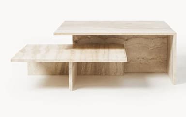 A tiered coffee table constructed from travertine stone, featuring a lower shelf and a higher, larger top surface. The design is geometric and minimalist, with the natural veining of the stone prominently displayed. — 3D model