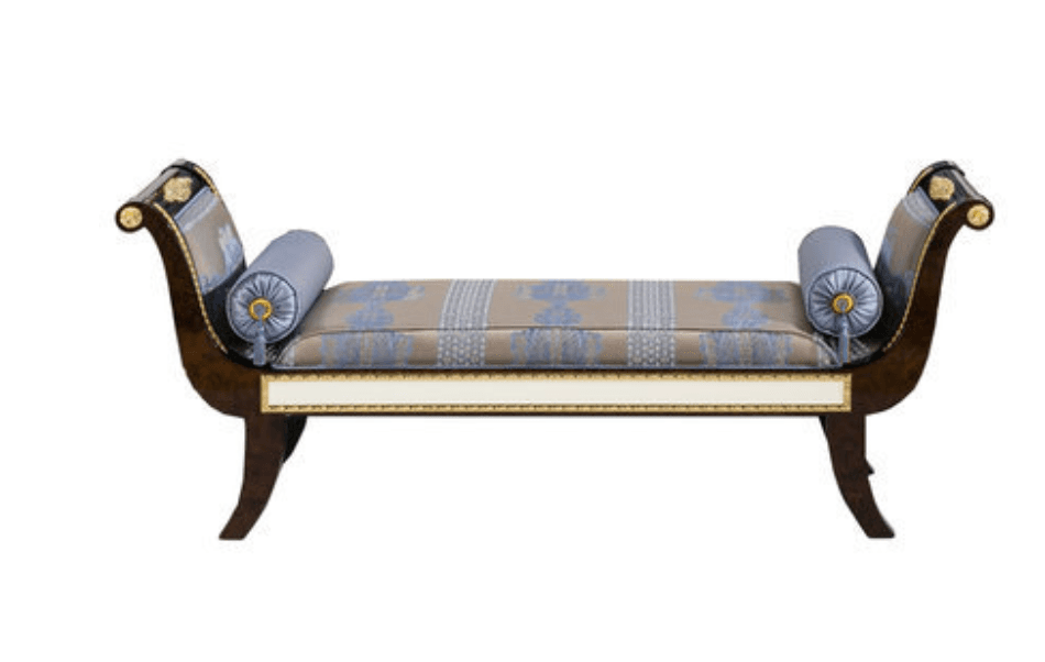 A formal recamier or daybed with a dark wood frame, featuring scrolled ends with elaborate gilt ornamentation. It has a padded upholstered seat in a patterned beige and blue fabric, and two cylindrical bolster pillows upholstered in light blue fabric with tassels. The lower front features a white panel framed by gold trim. The legs are curved sabre-style. — 3D model