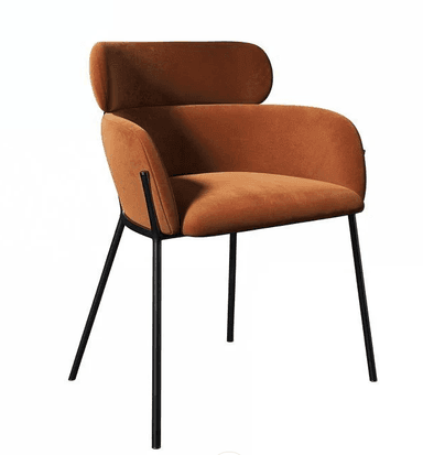 A modern dining chair featuring a rounded, padded seat and backrest upholstered in a rich rust-colored velvet or similar soft fabric. The seat and back appear as distinct, contoured elements. It is supported by a minimalist, four-legged black metal frame that extends upwards to secure the backrest, giving it a sleek and airy aesthetic. The legs are slender and angled, contributing to its contemporary design. — 3D model