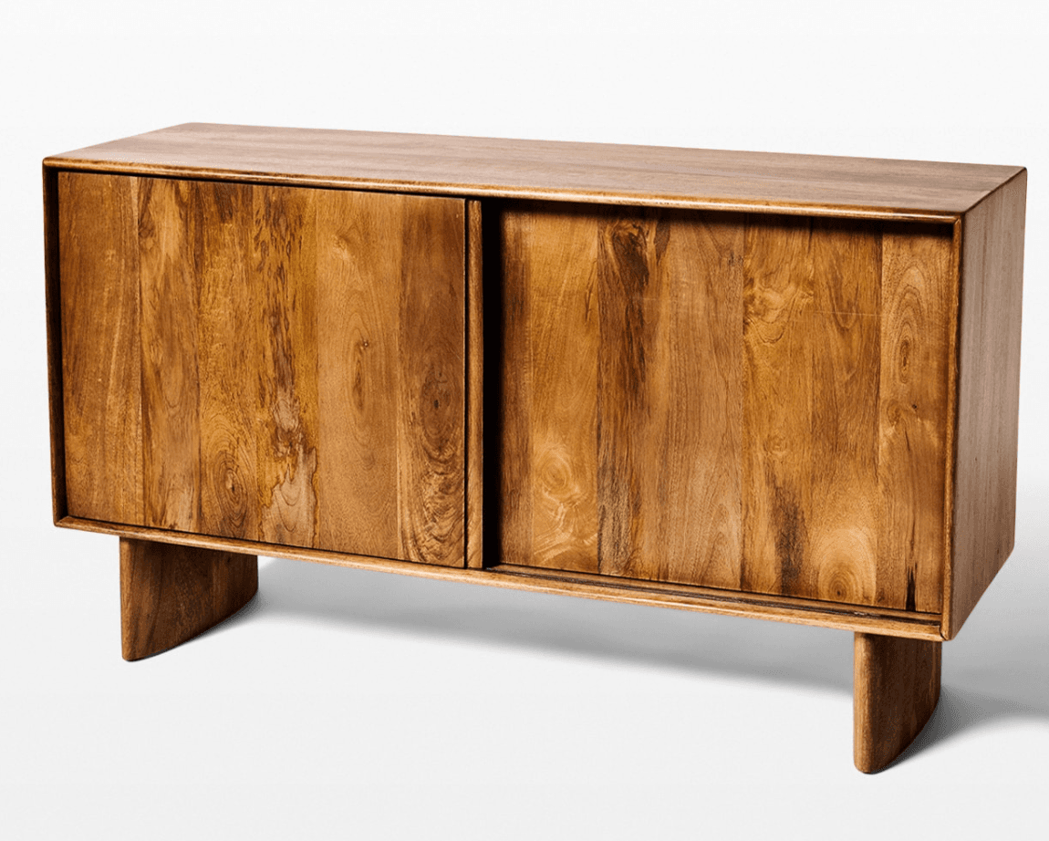A wooden sideboard with a natural wood grain finish. It features two sliding doors that conceal the storage space within. The unit is supported by two angled legs at the front and back, providing a modern aesthetic. — 3D model