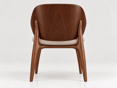 This is a contemporary armchair featuring a distinctive barrel-back design. The chair is upholstered in a light beige, subtly textured fabric with an intricate, organic pattern. A smooth, dark-stained wooden frame outlines the top and sides of the backrest, flowing down to form the four tapered legs. The seat cushion is integrated and matches the backrest's upholstery, creating a cohesive and inviting aesthetic. — 3D model