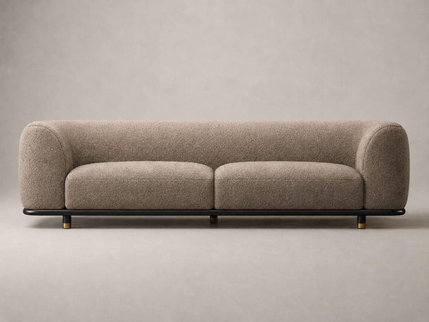 A modern two-seater sofa featuring a curvilinear, minimalist design. The body is fully upholstered in a textured, light brown or beige fabric, with integrated rounded armrests and backrest forming a continuous, sculptural silhouette. It rests on a sleek, black metal frame that extends along the bottom perimeter, supported by short, cylindrical brass-finished feet. The sofa has two distinct seat cushions, maintaining the clean lines of the piece. — 3D model