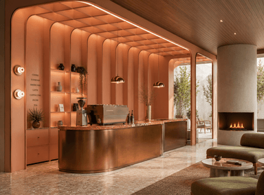 A modern counter unit, likely for a cafe or bar, featuring a curved marble countertop with integrated sink and espresso machine. The unit has a salmon-pink frame with vertical slat detailing and a lower section finished in a brushed bronze metal. Shelving and drawers are incorporated into the rear structure. — 3D model