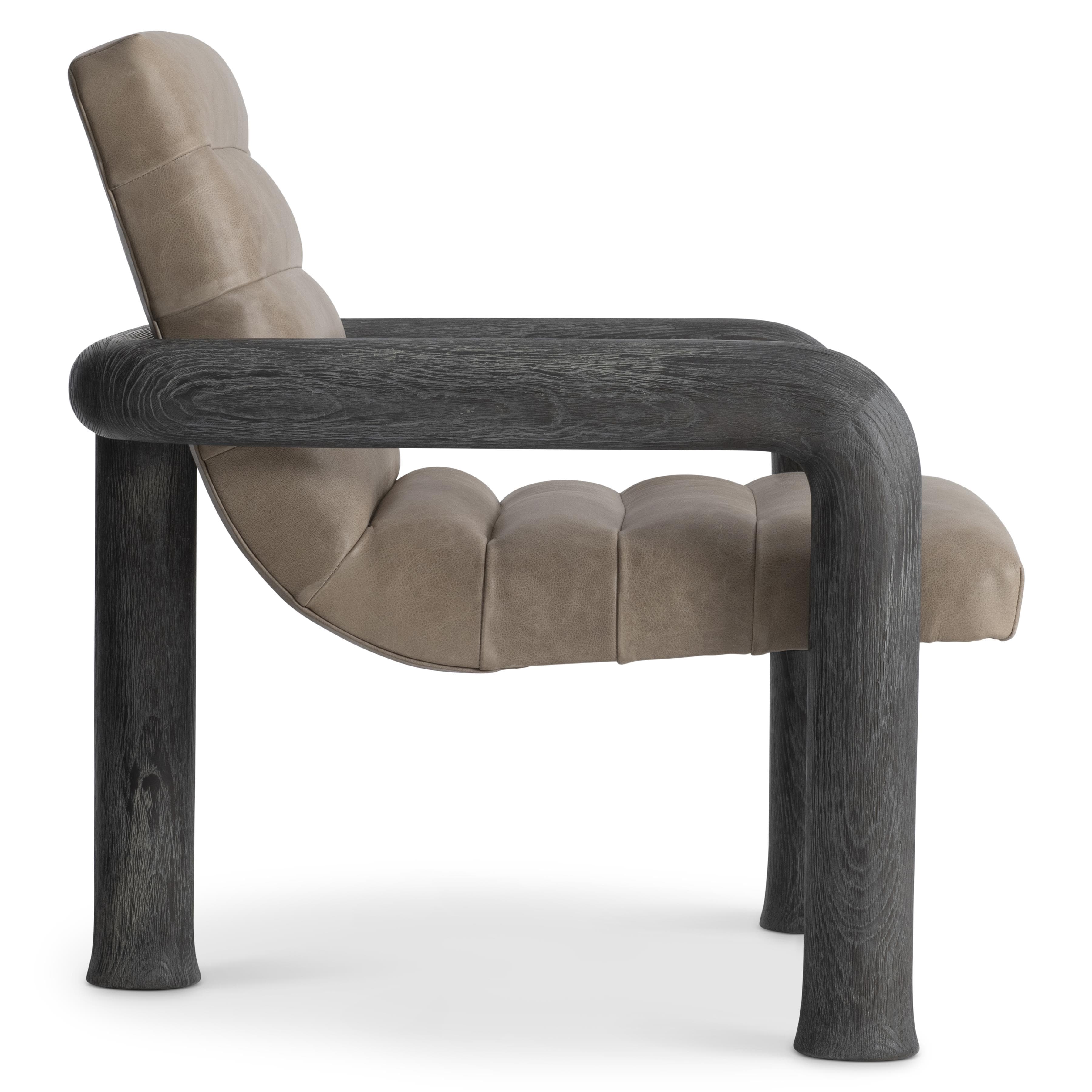A modern armchair with a distinctive design featuring a curved frame and upholstered seat and back. The frame is constructed from dark, textured wood, contrasting with the light-colored, tufted upholstery. — 3D model