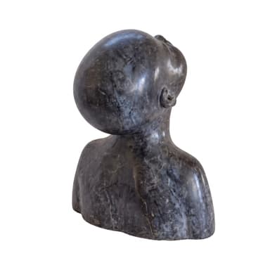 A dark-toned, stylized bust sculpture depicting a human head and partial upper torso, with the head tilted upwards and the gaze directed skyward. The material appears to be a dark stone with subtle veining and a matte finish. — 3D model