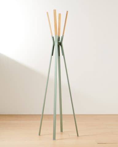 A freestanding coat rack with a base composed of multiple slender legs that converge upwards. The upper section features several wooden dowels or pegs extending upwards and outwards, likely for hanging items. The main body and legs appear to be made of metal or plastic, with a pale green or gray finish. — 3D model
