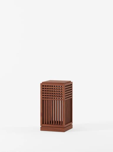 A rectangular wooden end table with a slatted design on its front panel. The slatted design consists of vertical slats and horizontal crossbars creating a grid pattern. The top surface is flat and solid. — 3D model