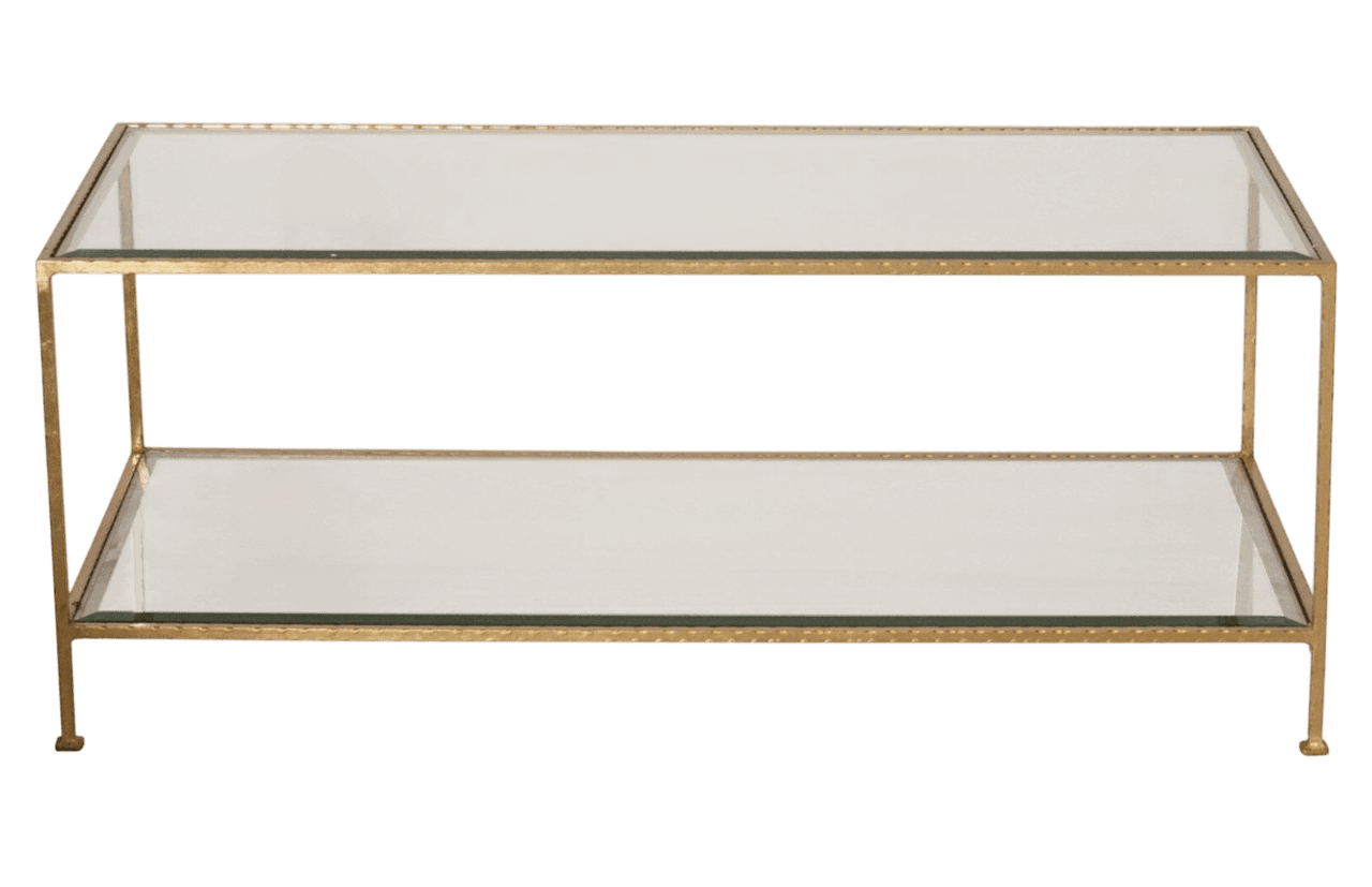 A two-tiered coffee table with a rectangular silhouette. The frame is constructed from metal with a gold finish, featuring slender legs that support the structure. Both the top and bottom surfaces are made of clear glass, providing a sleek and reflective appearance. — 3D model