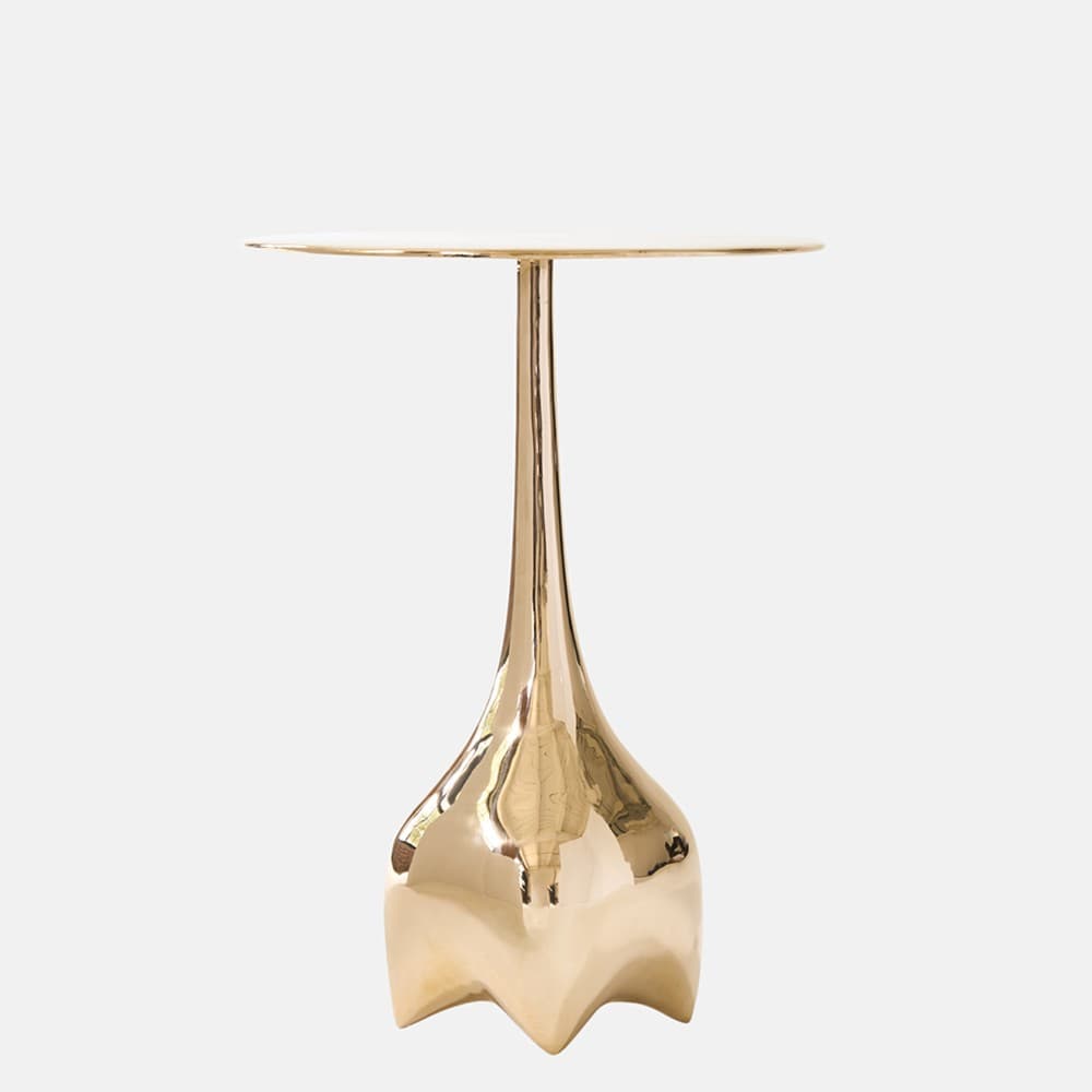 A striking gold-finished metal table featuring a circular top, a slender, tapered stem, and a distinctive sculptural base with a fluted, organic form. The entire piece has a lustrous, hammered-like texture, suggesting artisanal craftsmanship and a luxurious aesthetic. — 3D model