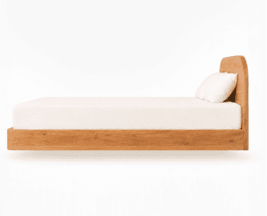 A modern platform bed crafted from light-toned wood, featuring an integrated headboard with smoothly rounded corners. The bed frame has a minimalist design, with the base appearing to float above the ground. It is presented with a light-colored mattress and pillows, suggesting a contemporary and serene aesthetic. — 3D model