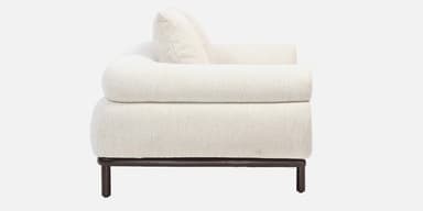 A contemporary loveseat upholstered in off-white bouclé fabric, featuring a plush, rounded design, broad armrests, and a recessed dark wood base with short, cylindrical legs. — 3D model
