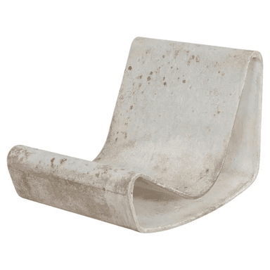 A sculptural lounge chair, likely made from a single piece of molded fiberglass or a similar composite material. It features a continuous, curved form that provides both the seat and backrest. The material is light-colored, possibly off-white, and shows significant signs of wear, discoloration, and potential staining, suggesting age or prolonged outdoor exposure. The design is minimalist and organic. — 3D model