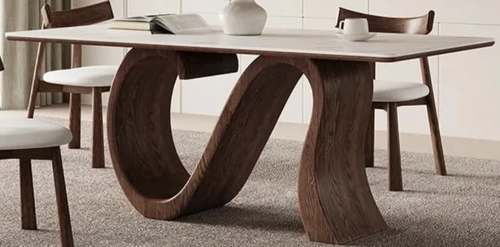 A modern rectangular coffee table featuring a white faux marble top and a unique, sculptural dark wood base with a curved, S-shaped design. — 3D model