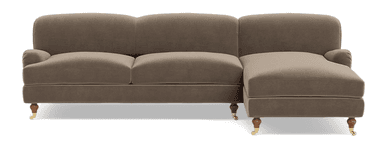 A modern sectional sofa with a chaise extension, upholstered in a light taupe fabric and featuring wooden legs, one with a brass caster. — 3D model