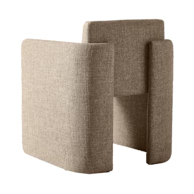 A contemporary armchair with a unique, geometric silhouette. The piece features a modular appearance with distinct, block-like sections forming the seat, backrest, and armrests. The upholstery is textured, suggesting a woven fabric. The overall form is solid and angular, yet the rounded edges of the visible surfaces provide a softer aesthetic. — 3D model
