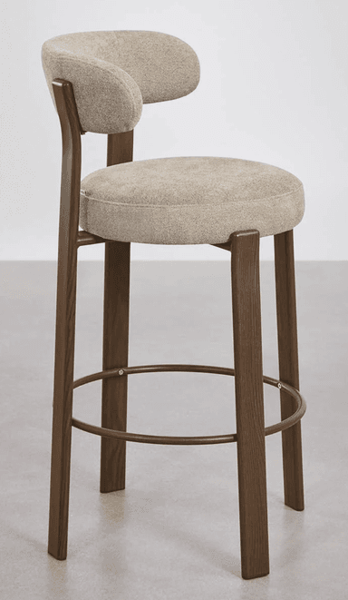 A contemporary bar stool featuring a dark wood frame, an upholstered seat, and a contoured upholstered backrest. It includes a circular metal footrest for comfort and stability. — 3D model