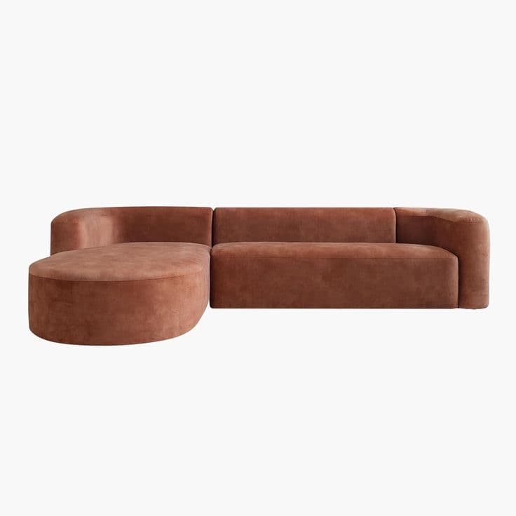 A modular sectional sofa with a rounded chaise lounge on the left and a straight sofa section on the right. The sofa features rounded armrests and a plush, upholstered finish. The design is contemporary with soft, organic lines. — 3D model