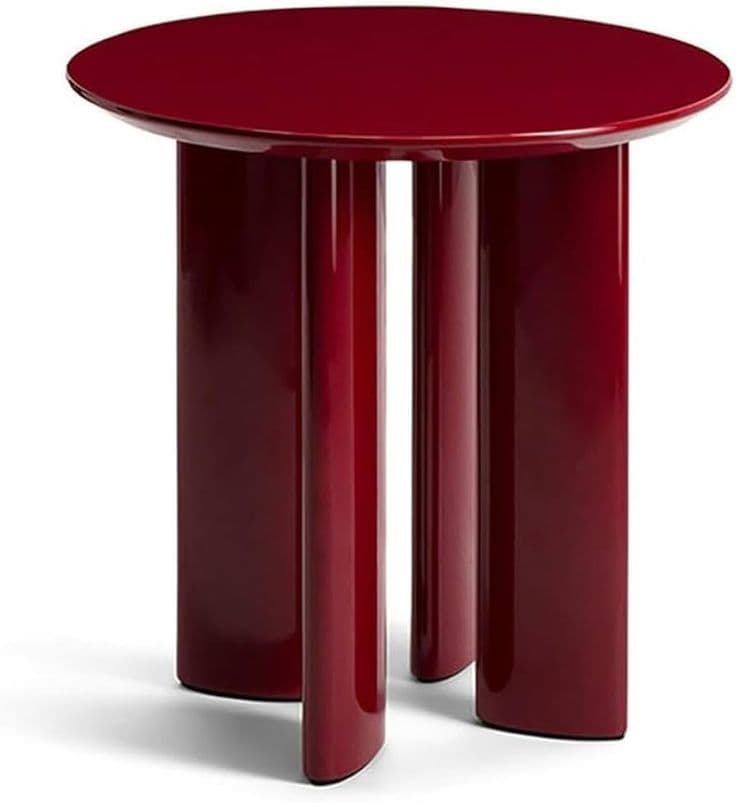 A contemporary accent table featuring a round top and three thick, columnar legs, all finished in a high-gloss deep red lacquer. — 3D model