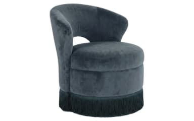A compact, barrel-shaped accent chair upholstered in dark grey velvet, featuring a continuous curved backrest and integrated armrests, and finished with a matching fringe trim around its circular base. — 3D model