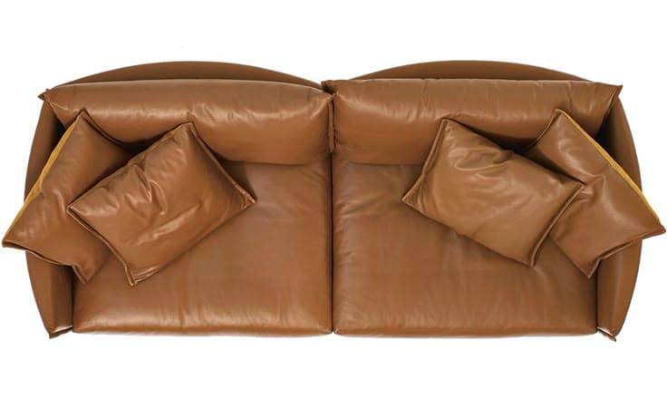 A two-seater sofa with a curved back and armrests, upholstered in brown leather. It features plush seat cushions and two loose throw pillows on each side, also upholstered in brown leather with visible stitching. The sofa has a contemporary design with soft, rounded edges and a slightly tufted appearance on the backrest. — 3D model