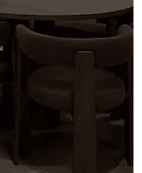 A contemporary dark brown wooden chair featuring a continuous, curved backrest that seamlessly transitions into integrated armrests. The seat is a matching dark wood, slightly contoured. The chair stands on four sturdy, straight legs, emphasizing smooth lines and a minimalist aesthetic. — 3D model