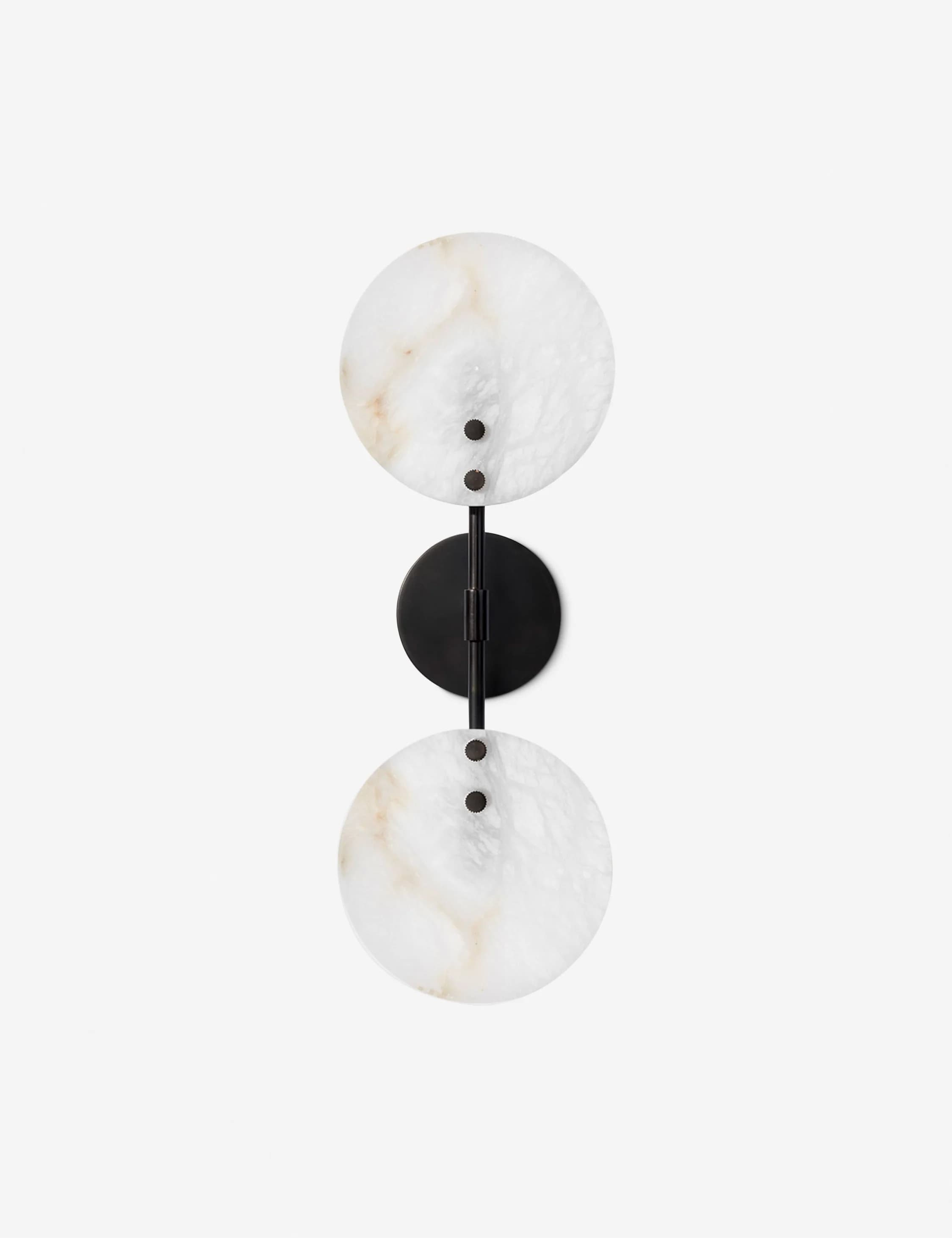 A modern wall sconce featuring two circular, translucent alabaster shades mounted vertically on a dark metal rod with a matching circular wall plate. — 3D model
