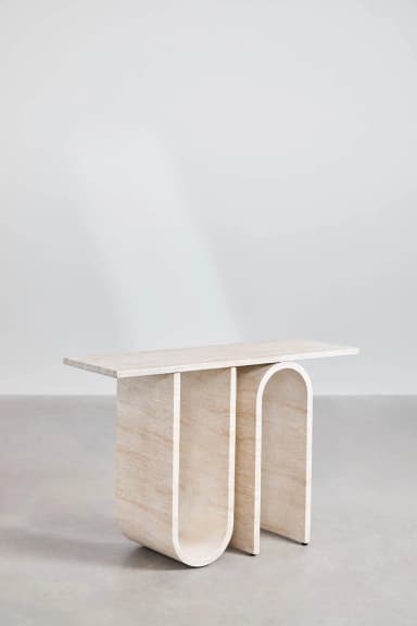A console table with a rectangular top supported by two arched legs and one straight leg. The design features curved elements and a minimalist aesthetic. — 3D model