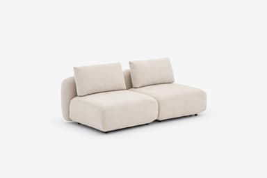 A sectional sofa unit with a low profile, upholstered in a textured, light-colored fabric. The design features rounded armrests and seat cushions, with a modular appearance. Visible stitching details indicate precise construction. The sofa has a contemporary, minimalist aesthetic. — 3D model