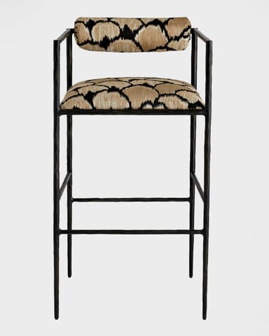 A modern bar stool featuring a slender black metal frame, an upholstered seat, and a cylindrical upholstered backrest. It includes integrated armrests and a built-in footrest. The upholstery features a distinctive geometric pattern in shades of beige/tan and black. — 3D model