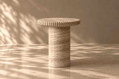 A small, round side table constructed entirely from natural travertine stone. It features a solid cylindrical pedestal base supporting a circular tabletop. The edge of the tabletop is distinctly fluted, providing a textural detail. The travertine exhibits its characteristic porous surface and natural striations in earthy beige and light brown tones. — 3D model