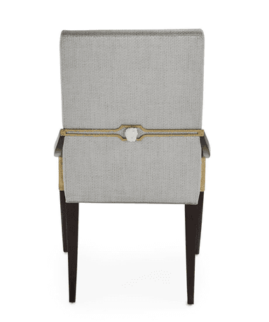 A finely upholstered armchair with a high back and curved armrests. The frame and legs are made of dark wood, with decorative detailing. The seat and back are covered in a textured light gray fabric. The legs have metallic accents near the feet and wrapped detailing around the upper section of the front legs. — 3D model