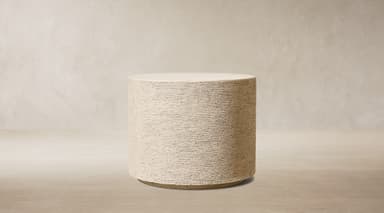A light beige, cylindrical object with a flat top, featuring a distinctively textured surface that suggests a composite or concrete-like material. It is uniform in diameter from top to bottom. — 3D model