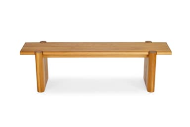A robust wooden bench constructed from solid oak, featuring a two-plank seat secured by visible circular dowel-like elements on top. The seat rests on two thick, rectangular slab legs, each with a distinctive vertical slot cut into its inner side. The wood has a natural, light brown finish with visible grain, and the edges are gently rounded, contributing to a substantial yet refined aesthetic. — 3D model