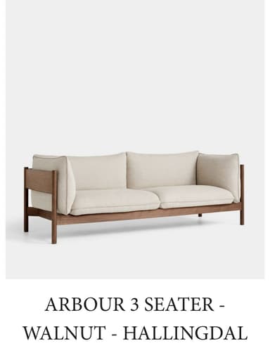 A modern two-seater sofa featuring a distinctive exposed wooden frame. The frame forms the base, legs, and partial sides, encasing plush, upholstered cushions. The cushions, for both the seat and back, are loose and covered in a light beige or cream fabric, distinguished by subtle piping along their edges. The armrests are formed by a curved upholstered section resting within the wooden frame, offering a clean and minimalist aesthetic. — 3D model